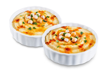 Hummus appetizer in a white bowl on a white isolated background
