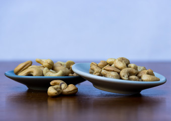cashew nuts on a wooden table
