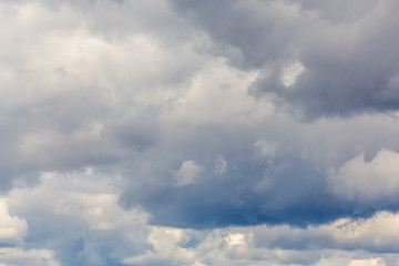 Fototapeta na wymiar Thunderclouds on a gray sky. Beautiful background