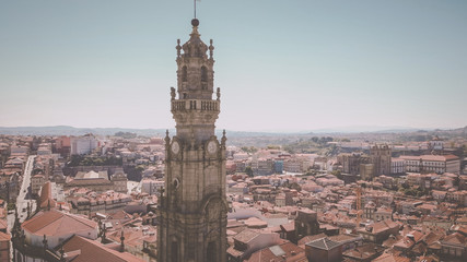 Obraz premium Aerial view of the Clerigos Tower (Torre dos Clerigos), one of the landmarks and symbols of the city of Porto, Portugal. Unesco World Heritage Site.