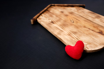 Blank Wood House with heart on black background. Concept sale, construction of ecological houses and discounts.