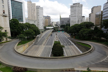Fototapeta na wymiar Empty street and avenue are seen in downtown Sao Paulo, Brazil, due to the Coronavirus outbreak, COVID-19.