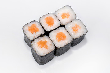 Japanese traditional roll with rice, nori and salmon on a white background