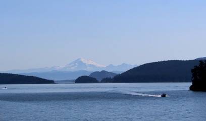 boat on the lake with mountain