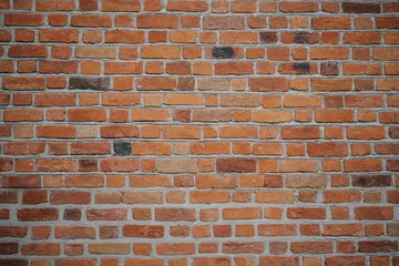 Vintage orange background texture red brick wall for graffiti or other images or text, advertis. Sintered red wall of an old building closeup.
