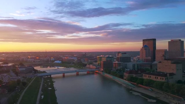 Drone panning from Dayton to beautiful sunrise on warm summer morning
