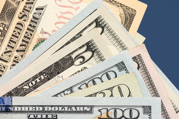 Many american dollar banknotes. Symbolic photo for debt and wealth.
