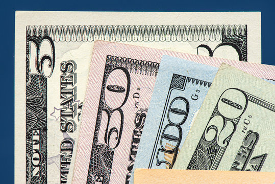 Many american dollar banknotes. Symbolic photo for debt and wealth.