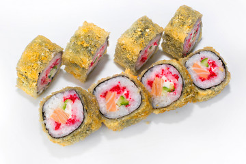 Japanese tempura roll of rice, salmon, cucumber, tobik and cream cheese on a white plate