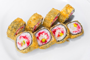 Japanese roll of rice, avocado, cream cheese, tobik, crab meat on a white background