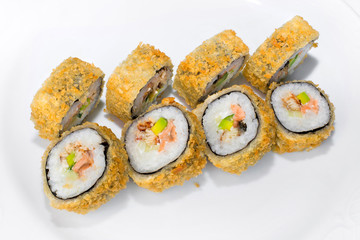 Japanese American roll of rice, mayonnaise, avocado, cucumber, salmon and eel on a white background