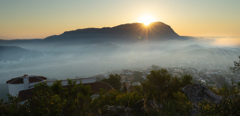 Golden sunrise in mountain. Sunrise with fog in mountain. Alicante, Gata de Gorgos, Montgo