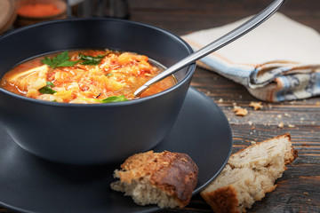 Red soup with vegetables and meat, tasty, traditional Ukrainian borsch, close-up, shallow depth of field, selective focus. Healthy Organic Homemade Food Concept
