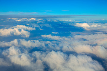Fototapeta na wymiar Flight Above Clouds in the Daytime 