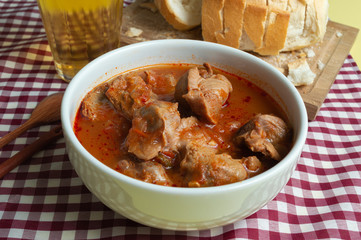 tasty and tradicional brazilian snack bar: gizzard, bread and cold beer.