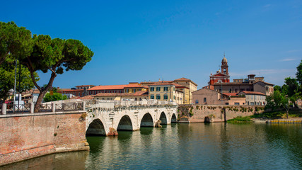 Old bridge over the river in the city of Rimini. Old Italy architecture