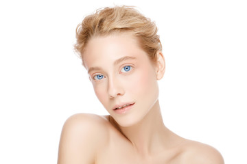 Young beautiful blond woman with blue eyes standing with naked shoulders, concept of female skin care and beauty, isolated on white background