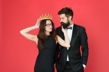 It is narcissism. Beauty queen and bearded man. Egoistic pride. Couple in love red background. Pride and vanity. Pride and ego. Selfish egoist. Success and ambitions. Pure pride in self