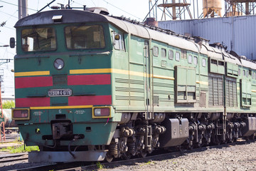 Ussuriysky Locomotive Repair Plant. An old locomotive car is being repaired in a railway depot