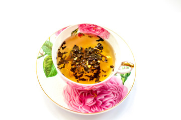 Cup of tea. Large tea leaves in a Cup. Large-leaf tea with fruit. Tea party.