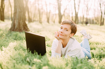 summer vacation park grass woman laptop communication