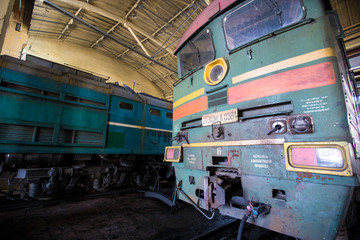 Ussuriysky Locomotive Repair Plant. An old locomotive car is being repaired in a railway depot