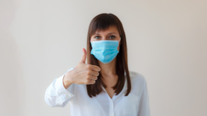 Caucasian young woman with respiratory mask approving protective mask for prevent infection....