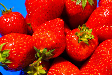 Healthy red fresh strawberries close up. Bright strawberries background.