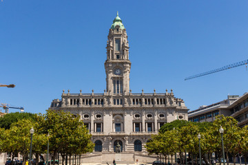 The Porto City Hall (Câmara Municipal) is perched atop the Avenida dos Aliados, or the Avenue of the Allies in Porto, Portugal. Garrett monument in Aliados Square.