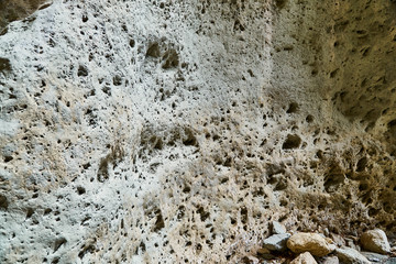 The texture of the stones. The stone splits. Rocks in the section. Tiles and mountains. The Wallpaper is grey.