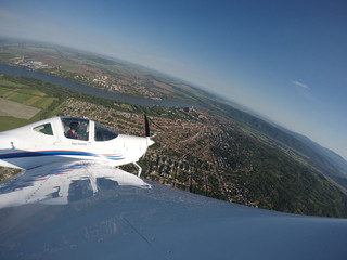 Fototapeta premium Solo training flight over Esztergom Hungary. Slovakia is across the Danube River.