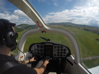 Trainee pilot approaching to a grass runway. Shallow depth of field. © M.Ecevit