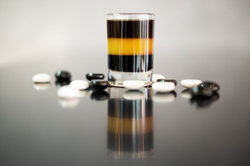 beautiful photo of an alcoholic shot prepared by a bartender at the bar