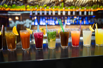 beautiful photo of many different cocktails prepared by a bartender at the bar