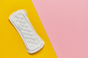 Women pad on a yellow and pink background