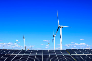 Solar photovoltaic panels and wind turbines.