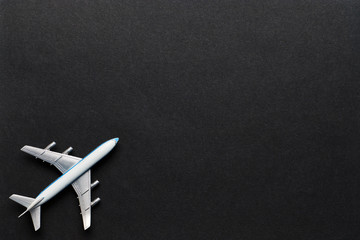 Airplane on a black background with copy space