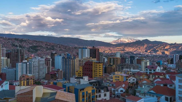 La Paz, Bolivia, day to night timelapse view of cityscape and Illimani mountain.