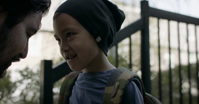 Back to school. Father get's son ready to go back to school. Father and son. Slow-motion captured on RED camera in 4k.