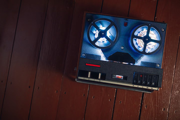reel to reel audio tape recorder with blue led light strip