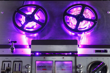 reel to reel audio tape recorder with purple led light strip