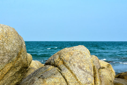 Large rocks located on the beautiful seashore
