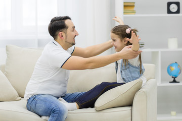 Obraz premium Father is having fun with his little daughter.