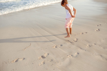 happy  little girl have fun and joy time at beautiful beach