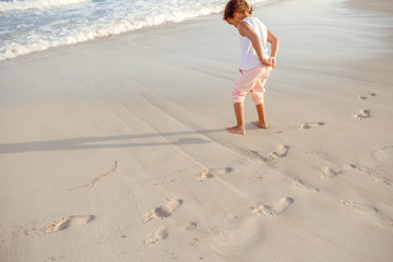 happy  little girl have fun and joy time at beautiful beach
