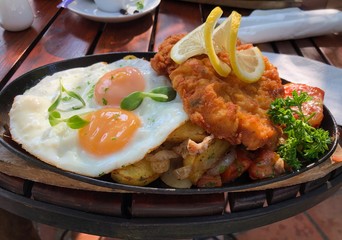 Schnitzel, Fried Eggs, and Potatoes Breakfast Full Shot