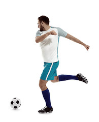 Young man playing football on white background