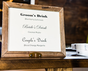 Bride and Groom sign with favorite drinks listed