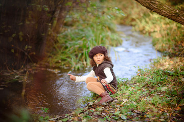 Happy Little Girl playing in the river.