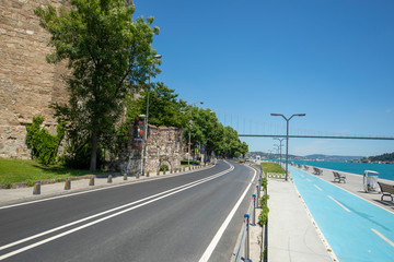 Naklejka premium Emirgan road near Bosphorus and castle wall